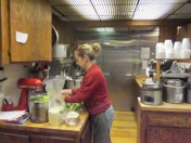 Liz the owner prepping for a busy day at Dave's Deli