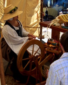 A spinner creates thread for cloth 